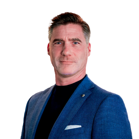 Man in blue blazer and black shirt, looking forward with a neutral expression.