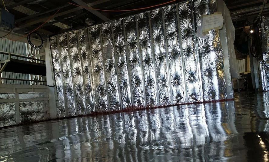 A room with a lot of aluminum foil on the walls.