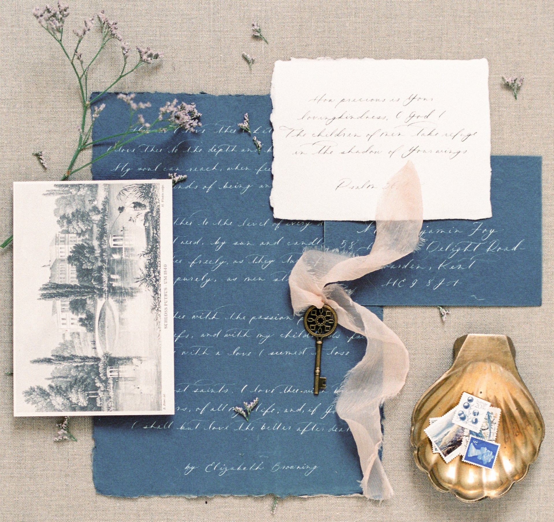 A collage of papers and a key on a table