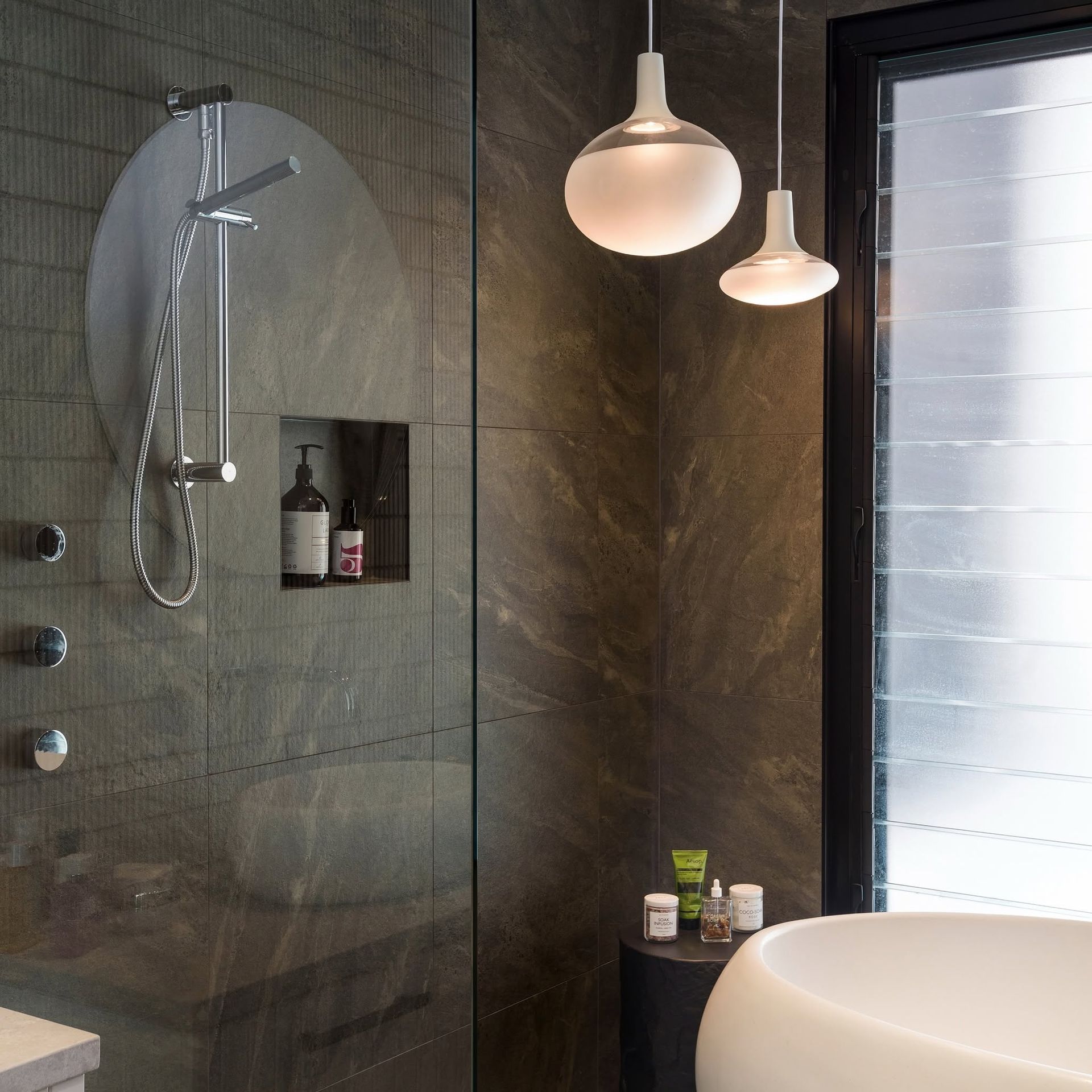 Modern Bathroom With Glass Shower, Pendant Lights, and Freestanding Tub — DSR Plumbing Pty Ltd in Ashtonfield, NSW