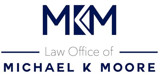 Logo for the Law Office of Michael K Moore. The logo has the initials MKM in blue, with