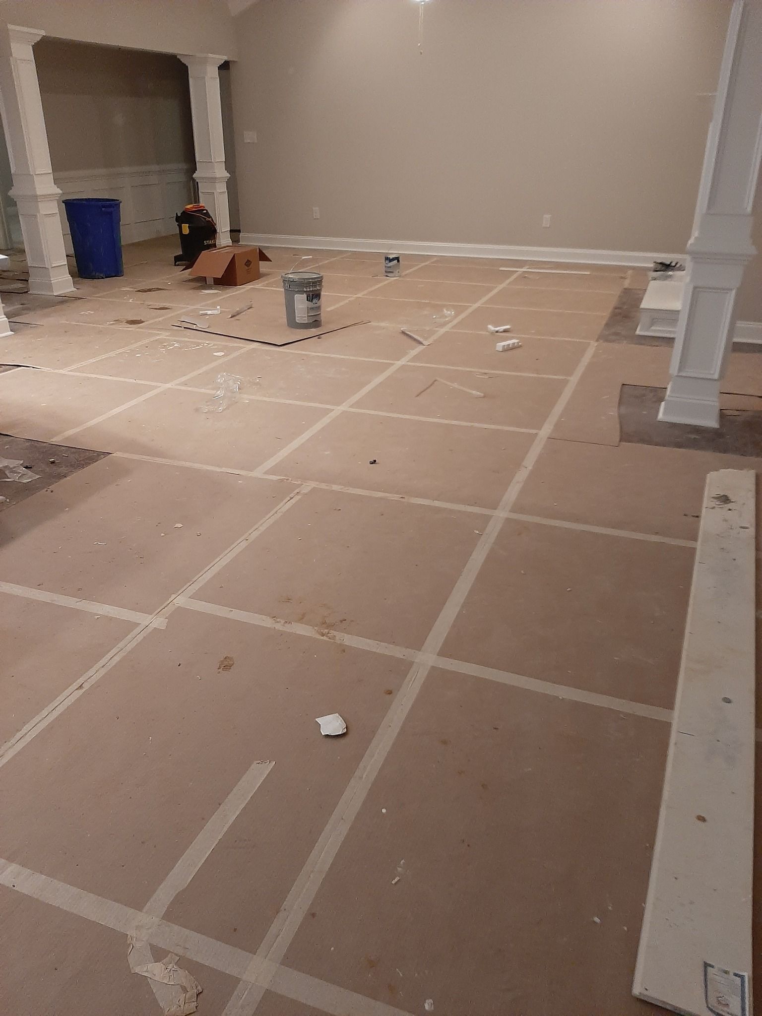 A room with a lot of tape on the floor.