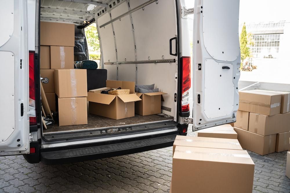 White Van With Open Back Doors With Packages — Lite Moves Furniture Removals In Sydney, NSW