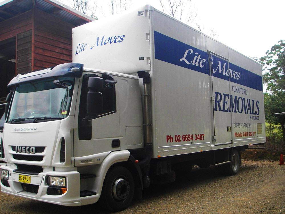 White Lite Moves Moving Truck With Blue Accents Parked Outdoors — Lite Moves Furniture Removals In Sydney, NSW
