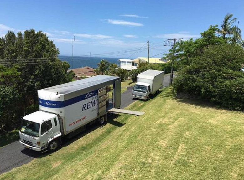 Removal Truck Waiting To Be Unloaded Outside New Home — Lite Moves Furniture Removals In Bonville, NSW