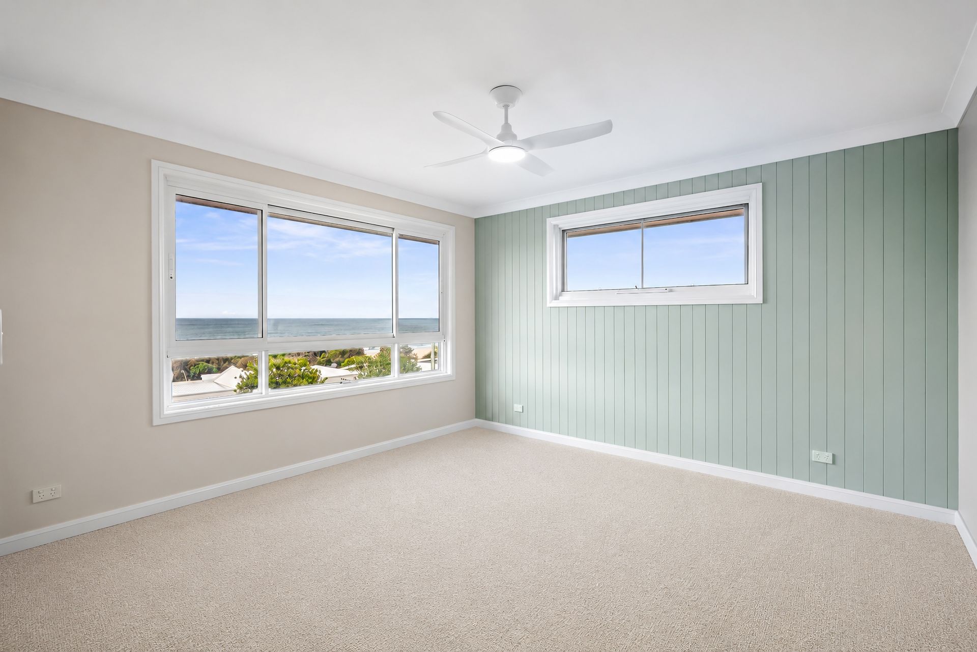 Empty Bright Bedroom With Pale Green Paneled Wall — PK4 Projects in Port Macquarie, NSW