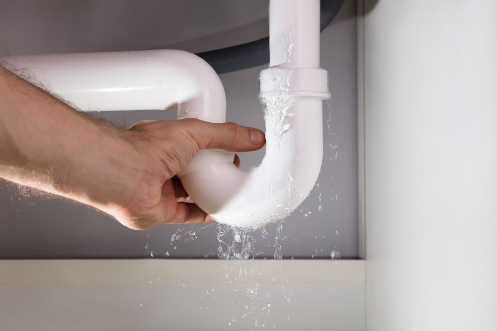 Leaking Pipe With Plumber — Sampson Plumbing Pty Ltd In Casuarina, NSW