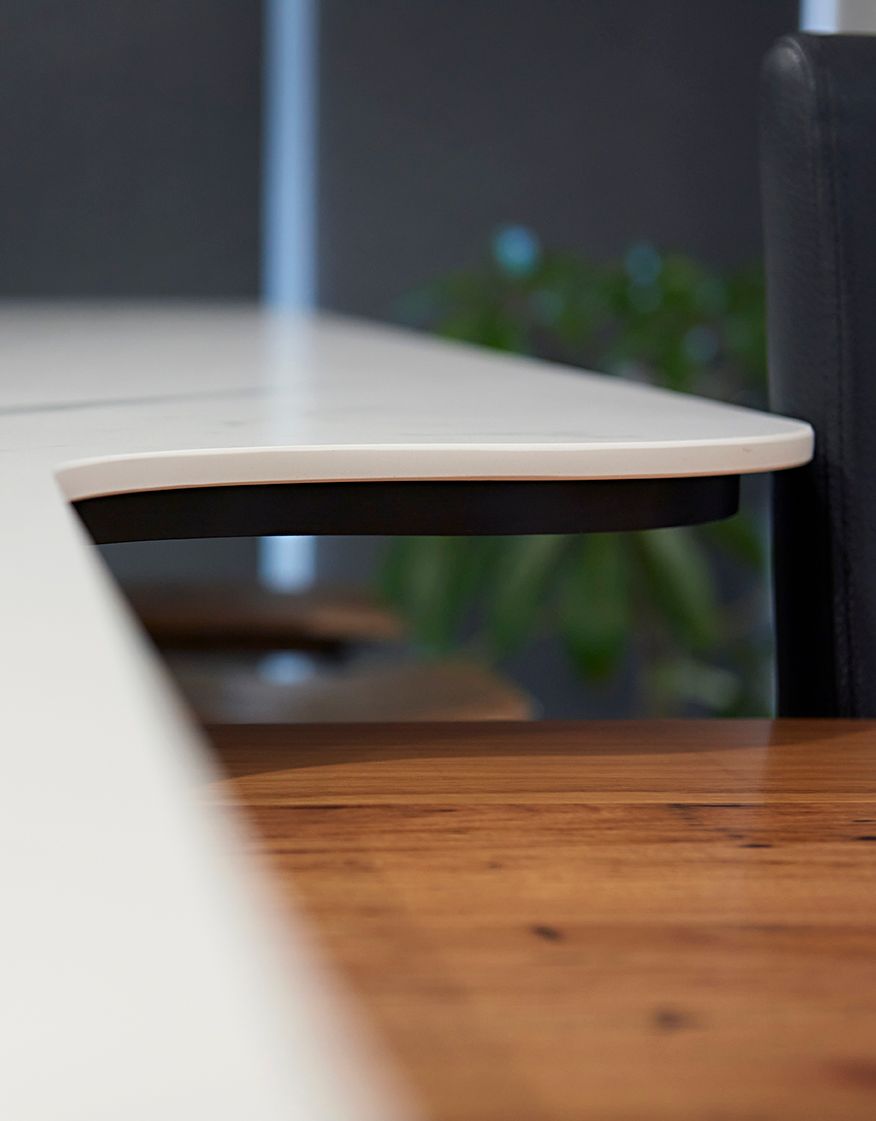island kitchen with lower-level timber table