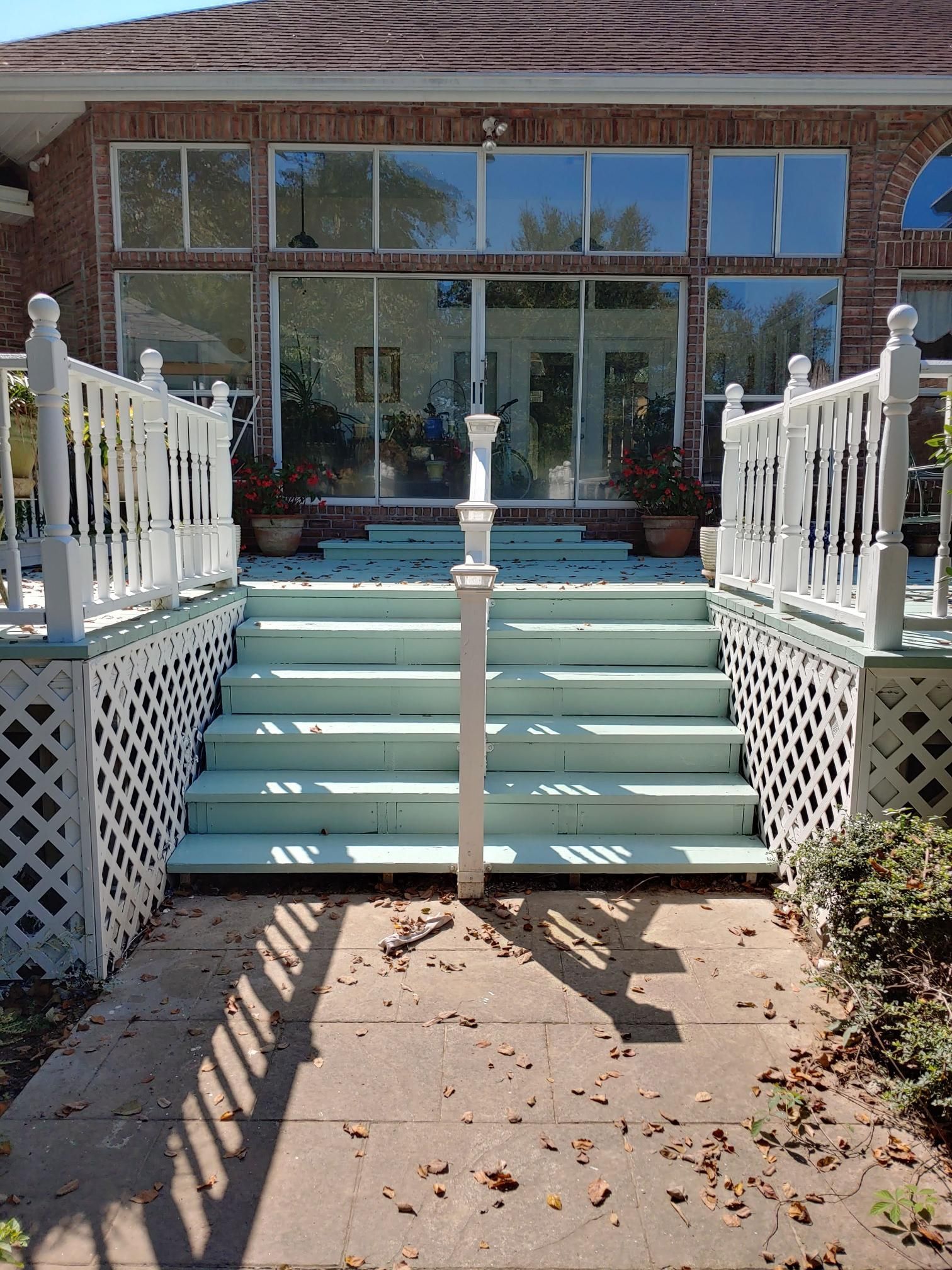 A set of stairs leading up to a brick house