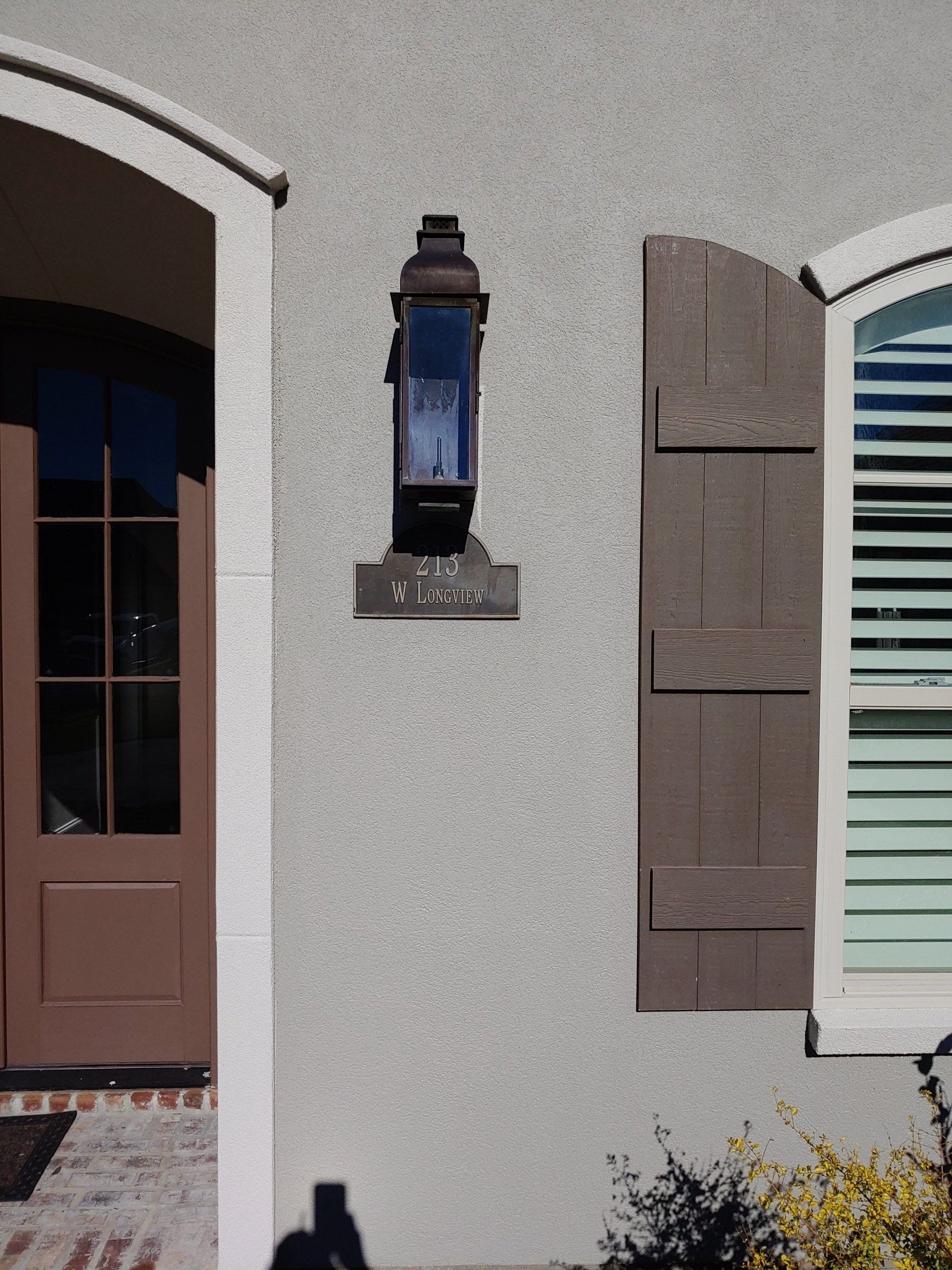 A house with a lantern on the side of it