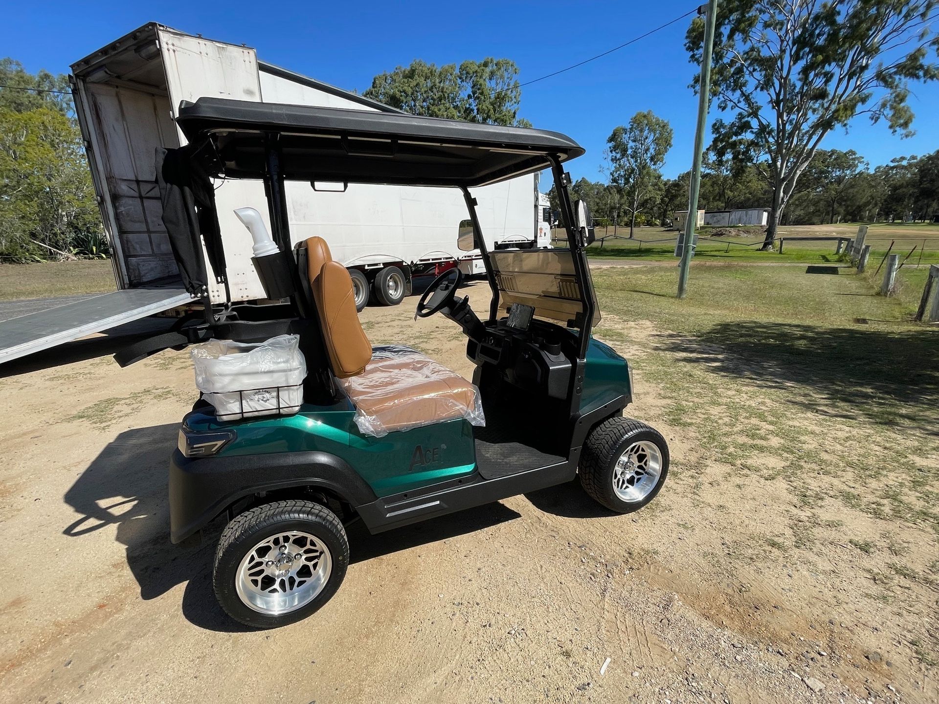 Green Golf Cart With Brown Seats — Buggies & Batteries in Emerald, QLD