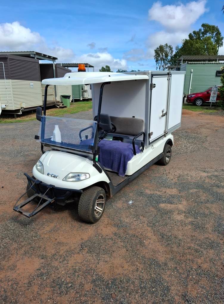 White Utility Cart With Enclosed Cargo Area — Buggies & Batteries in Moranbah, QLD