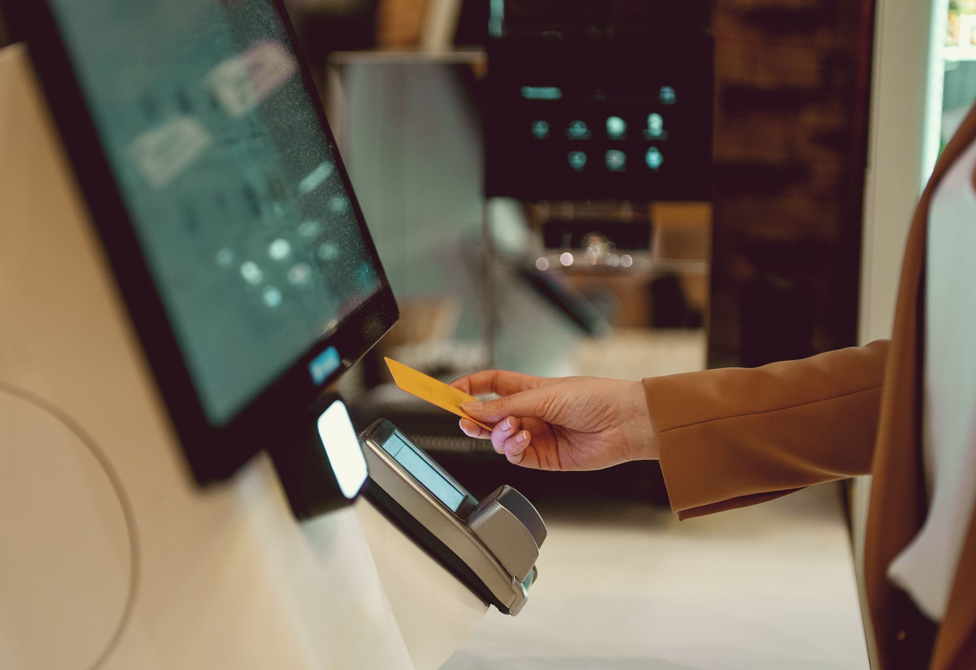 Person scans smartphone with a barcode reader at a counter. Person scans smartphone with a barcode reader at a counter.