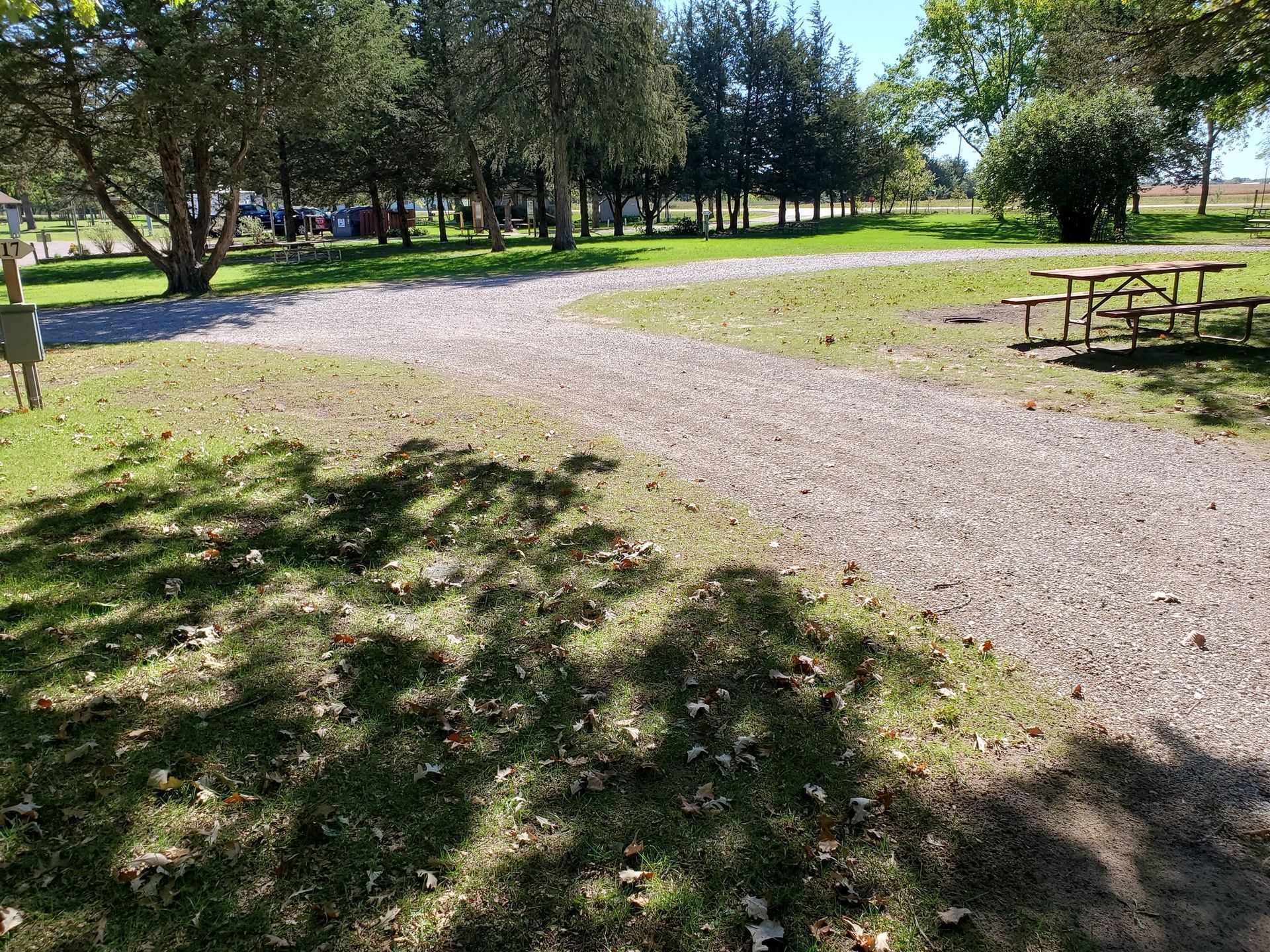 There is a picnic table in the middle of the park.