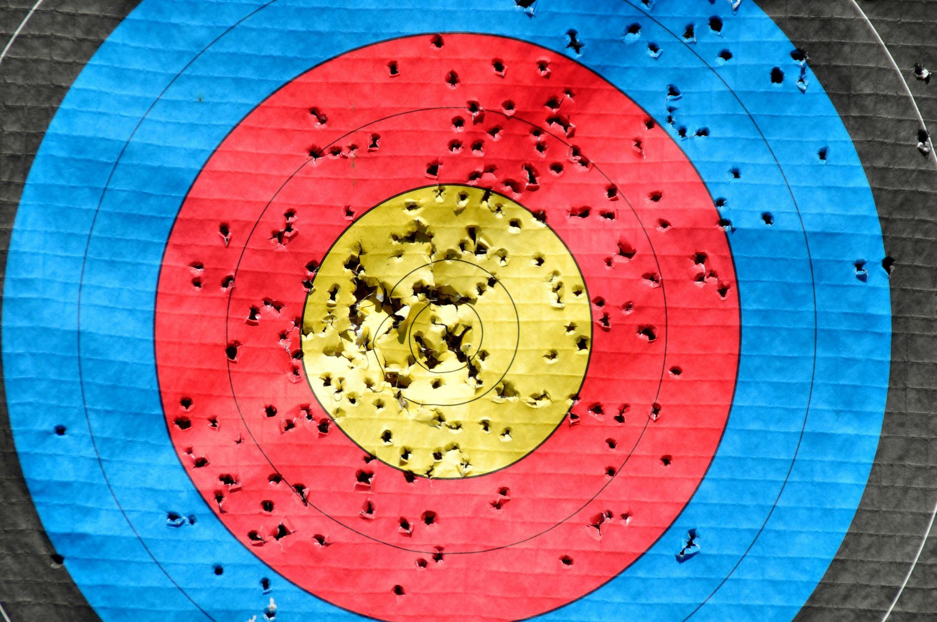 A blue red and yellow target with a yellow center