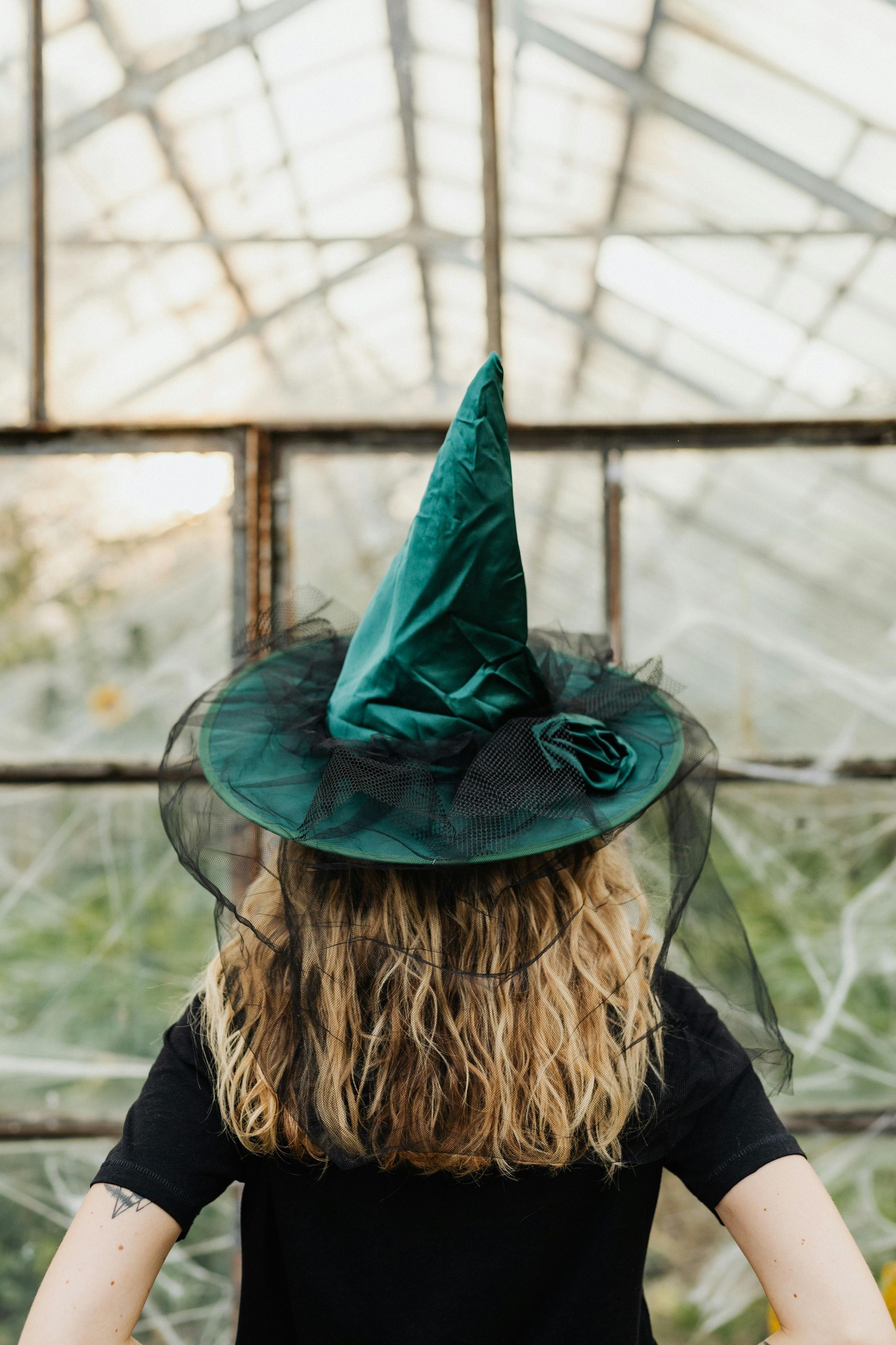 Woman in a green which hat