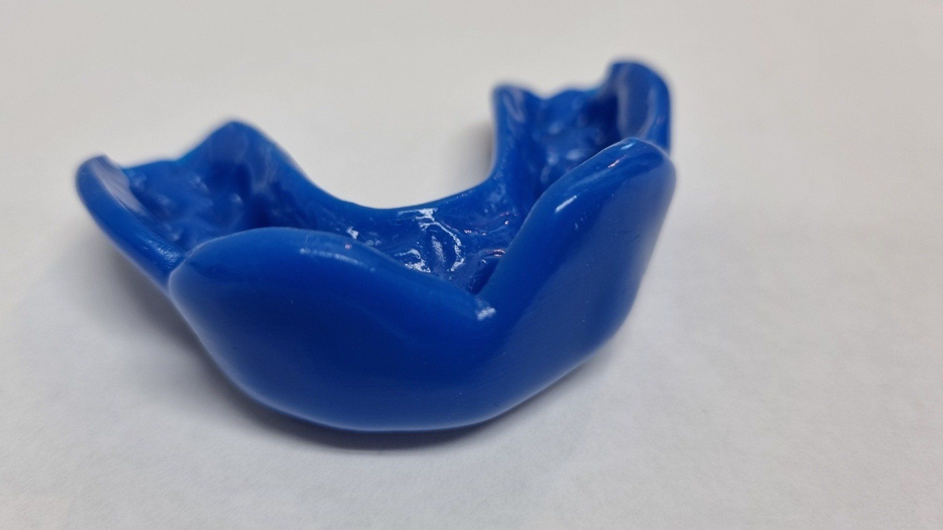Dark Blue custom sports mouthguard by The Denture Care Group — The Denture Care Group Sunshine Coast in Caloundra, QLD
