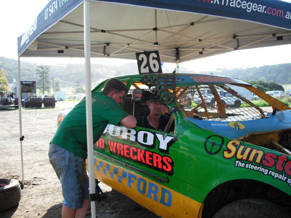 A Man Checking The Race Car — Sunshine Coast, QLD — Cooroy Auto Wreckers