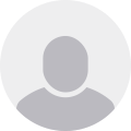 A gray circle with a silhouette of a person in it.