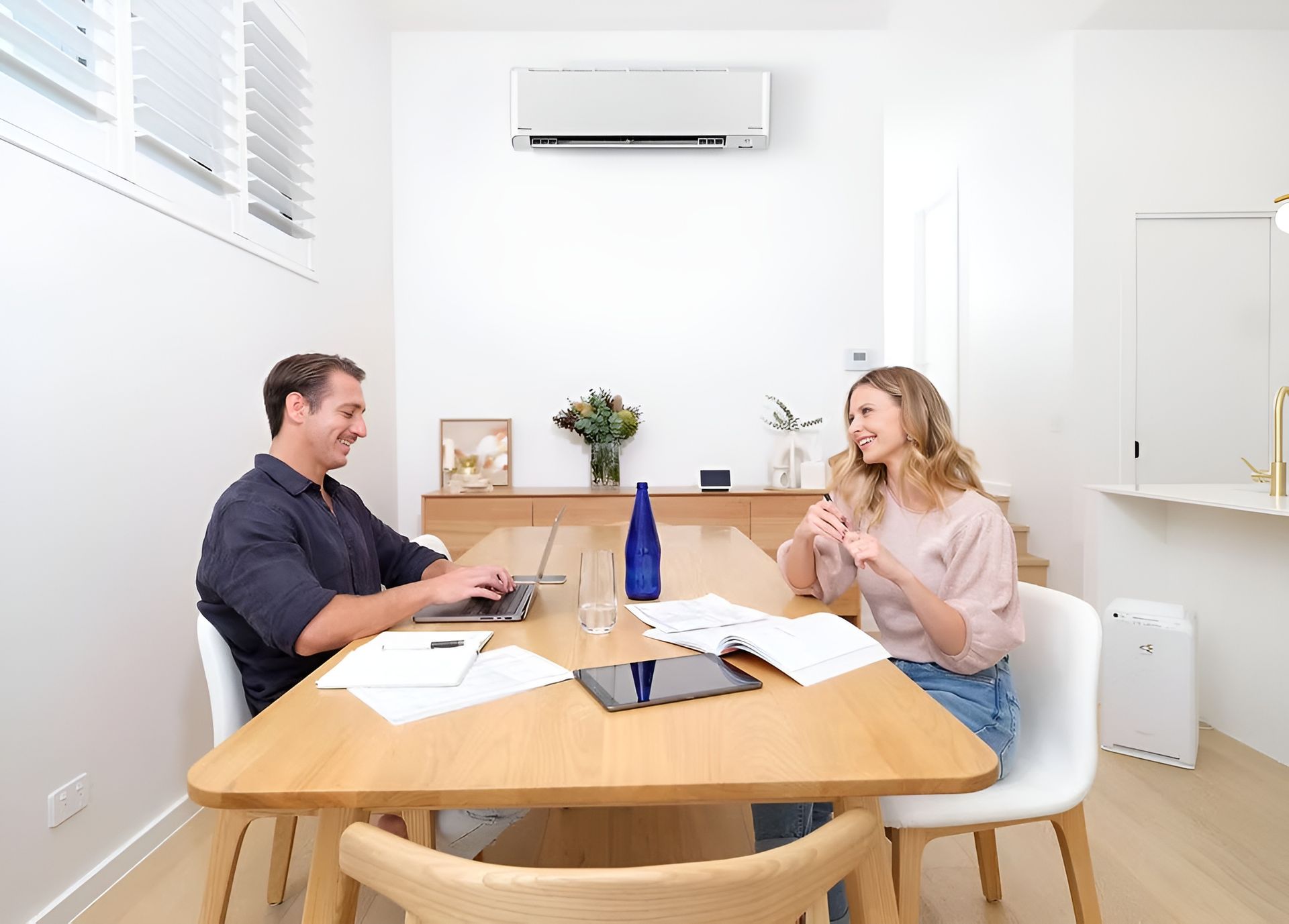Family in A Modern Kitchen with A Dog, Gathering in a Kitchen Island — FrostyCo Air-Conditioning in Cannonvale, QLD