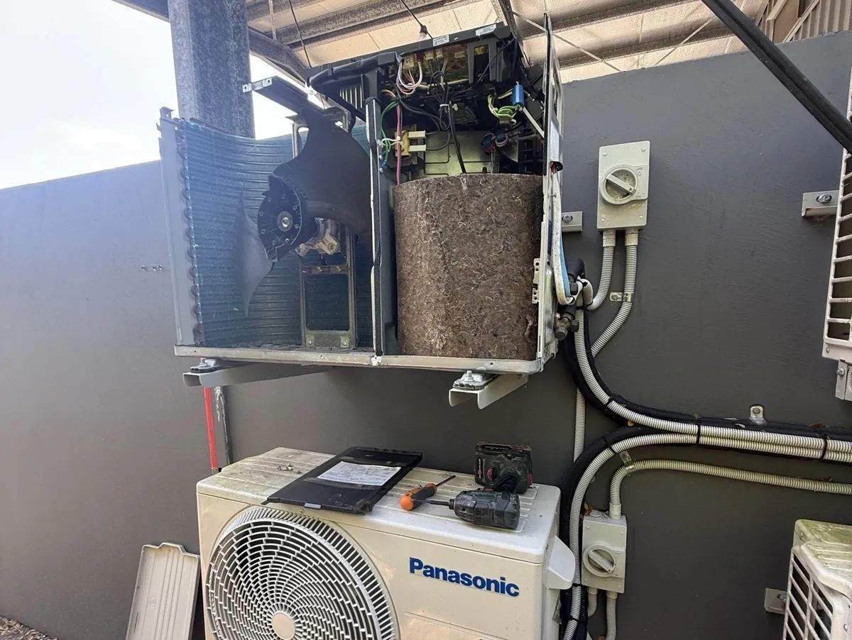 Air Conditioner With Exposed Internal Components — FrostyCo Air-Conditioning in Cannonvale, QLD