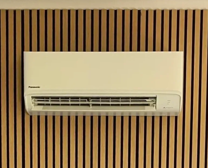 Wall-Mounted Air Conditioner Blowing Cool Air in A White Room — FrostyCo Air-Conditioning in Proserpine, QLD