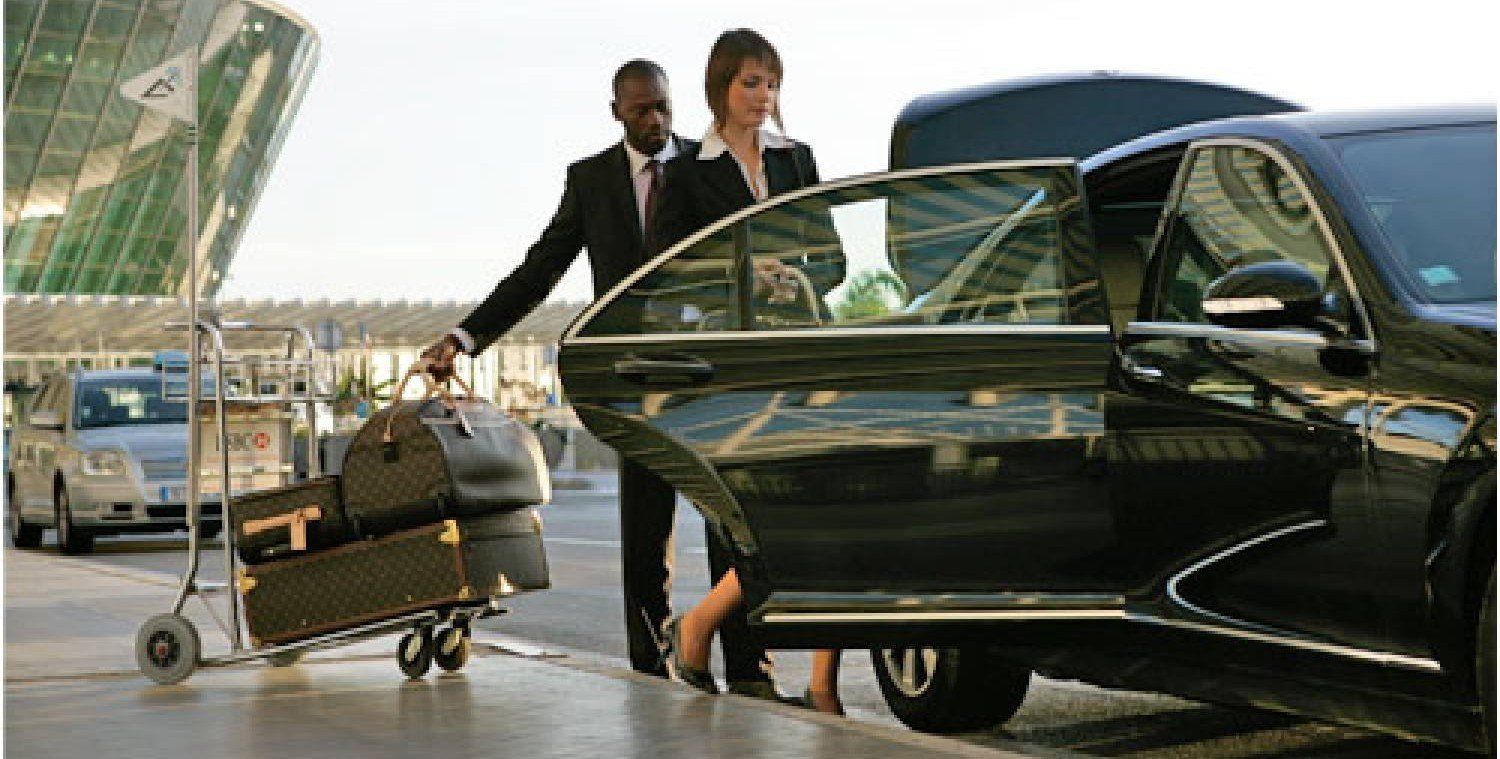 A man and a woman are getting out of a car