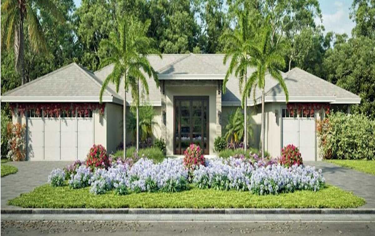 Front view of a modern Florida home with palm trees and low-profile, storm-ready landscaping.