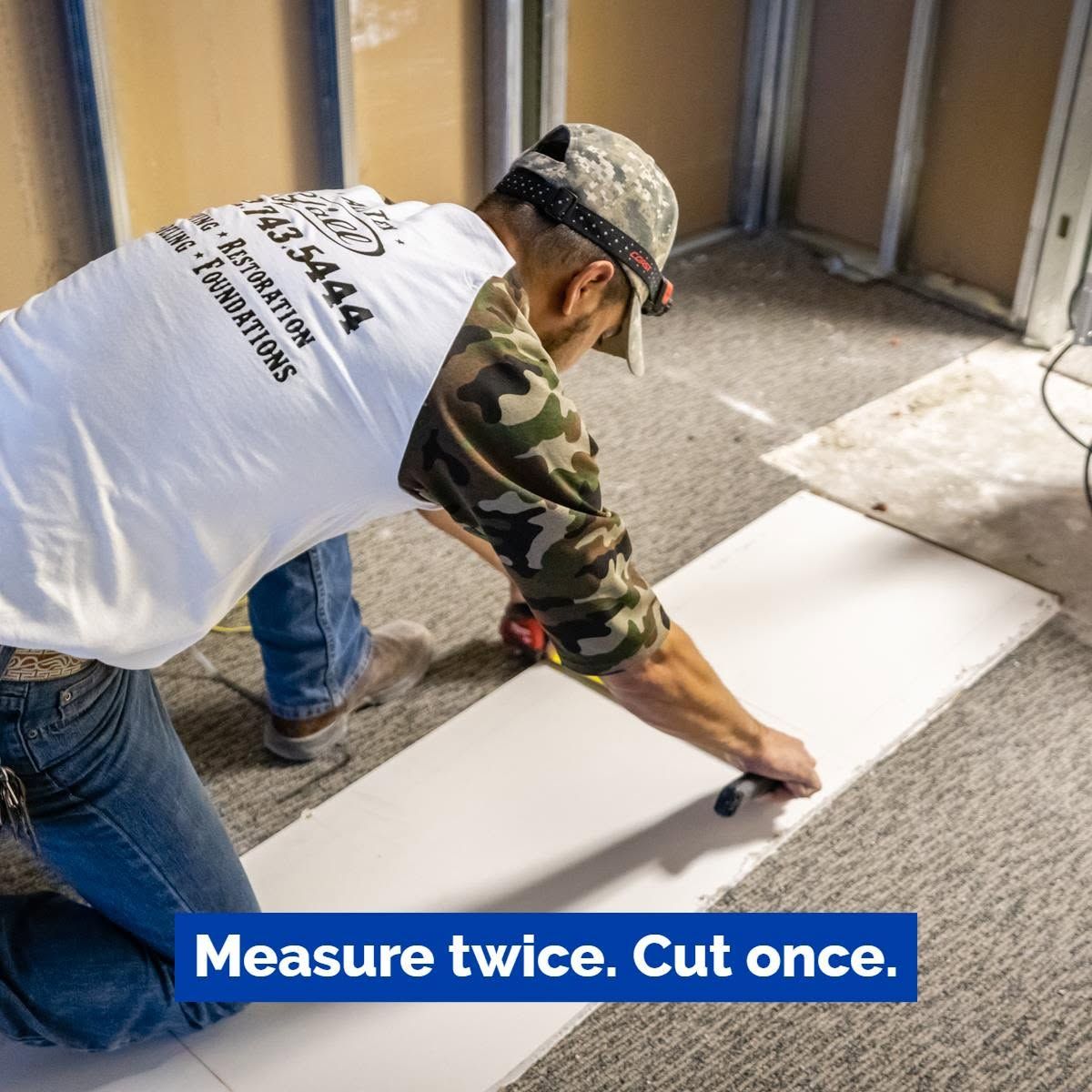 Worker cutting a white board on the floor with a saw; caption reads, “Measure twice. Cut once.”