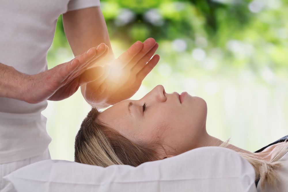 Person Receiving Energy Healing with Hands Glowing — Beauty In Profile In Salamander Bay, NSW