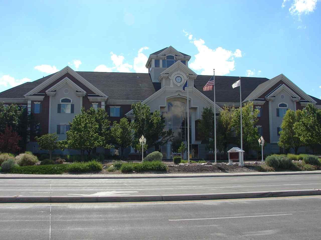 A large brick building with a clock on the top of it