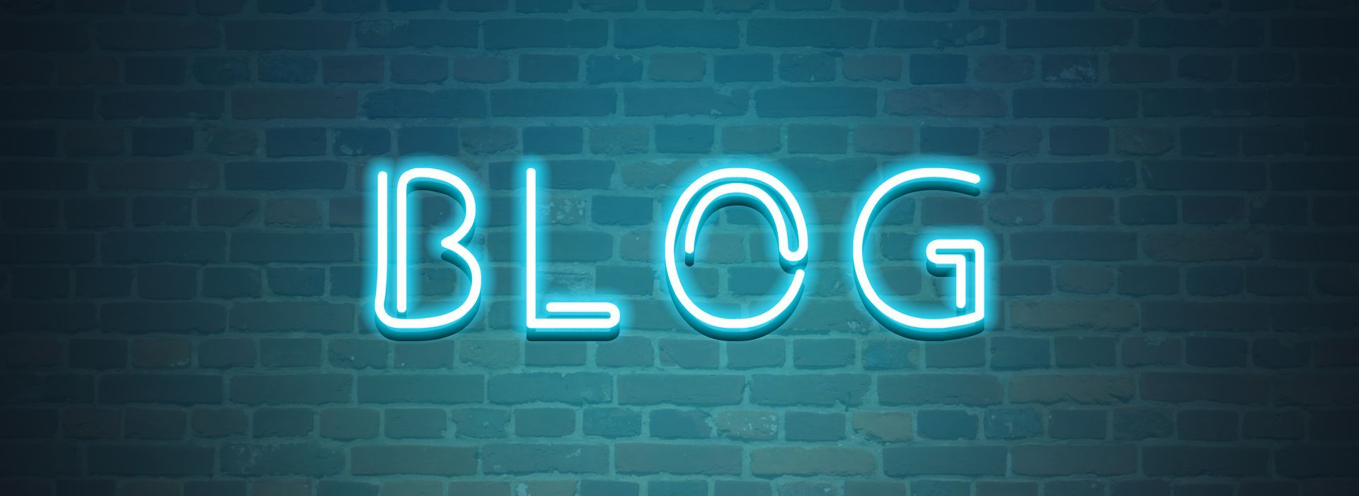 A neon sign that says blog on a brick wall.