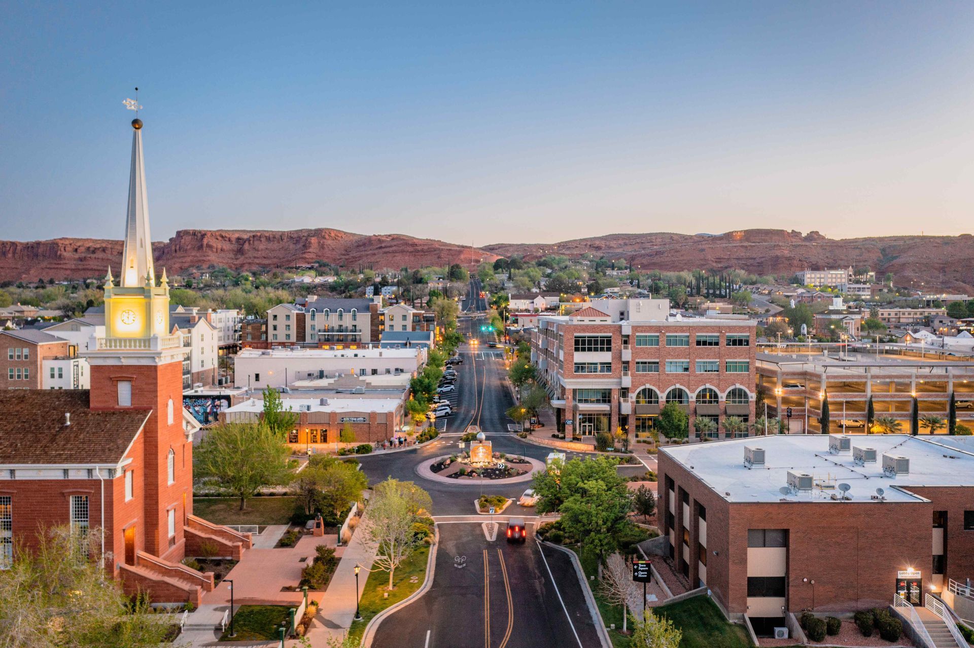 An aerial view of a St. George Utah, with a church and a clock tower.