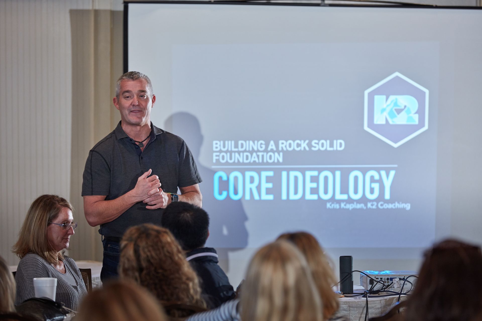 kris kaplan is giving a presentation about core ideology