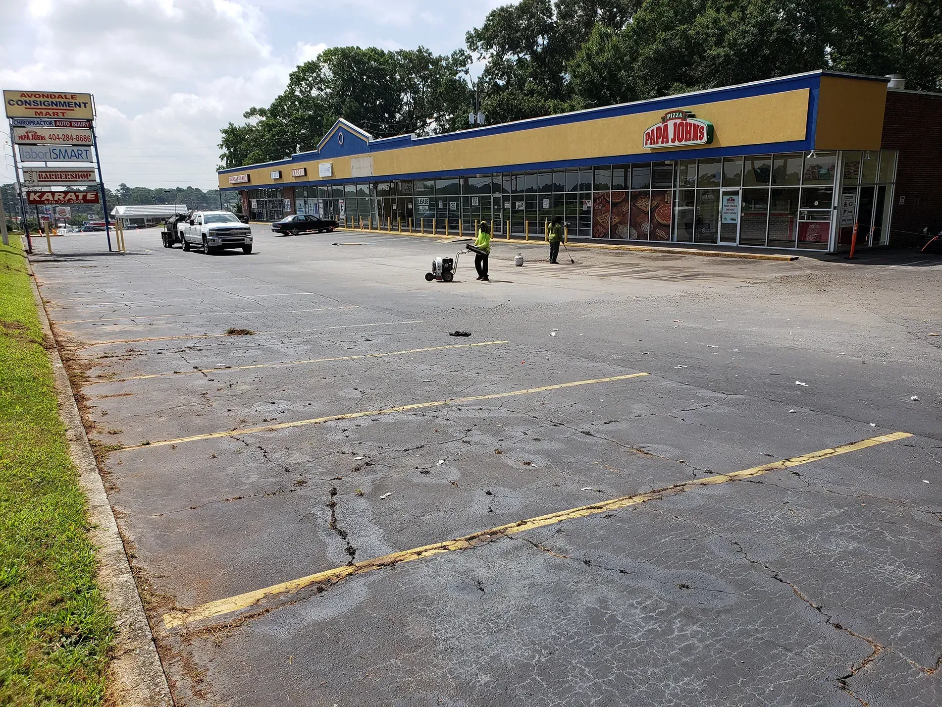 cracked parking lot at a strip mall