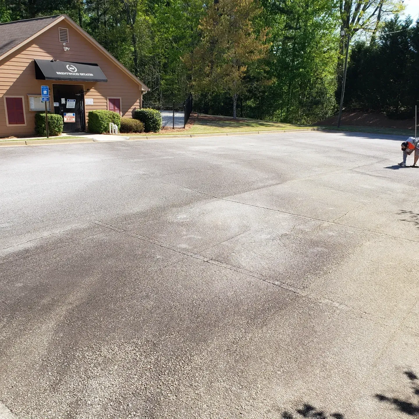 Faded parking lot with no parking spaces