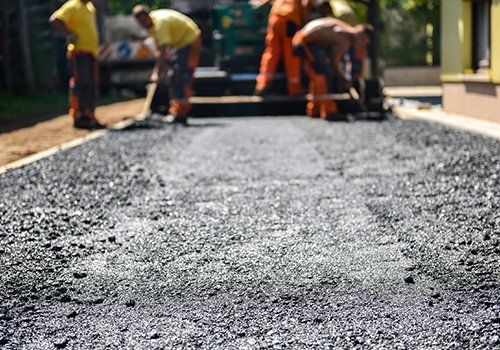 Workers constructing asphalt road — Plainfield, IL — Power Paving
