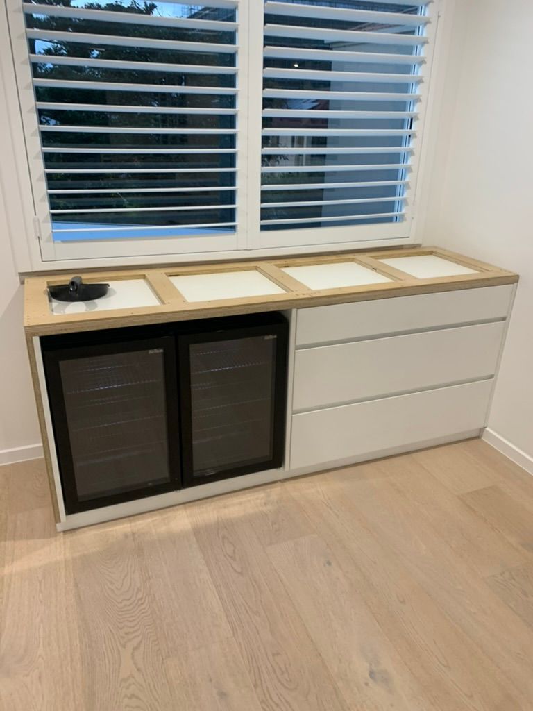 Small Kitchen Nook with White Cabinets, Wooden Countertop, and Window Blinds— JPR Concepts in Burleigh Heads, QLD