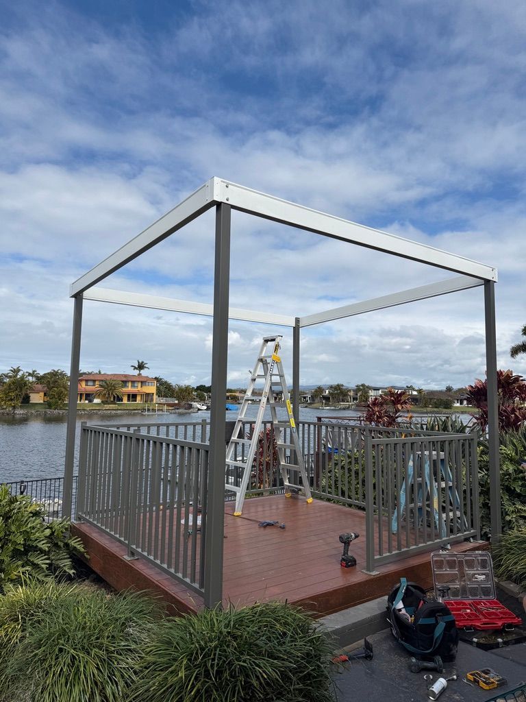 Covered Deck Under Construction by The Water and A Partly Built Roof Frame — JPR Concepts in Burleigh Heads, QLD
