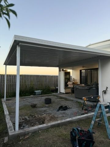 Partially Built Patio Roof with Steel Posts and Construction Materials in A Backyard — JPR Concepts in Burleigh Heads, QLD