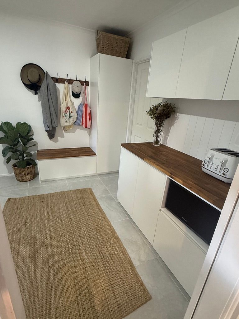 Small White Entryway with Wall Hooks and Cabinet Storage — JPR Concepts in Burleigh Heads, QLD