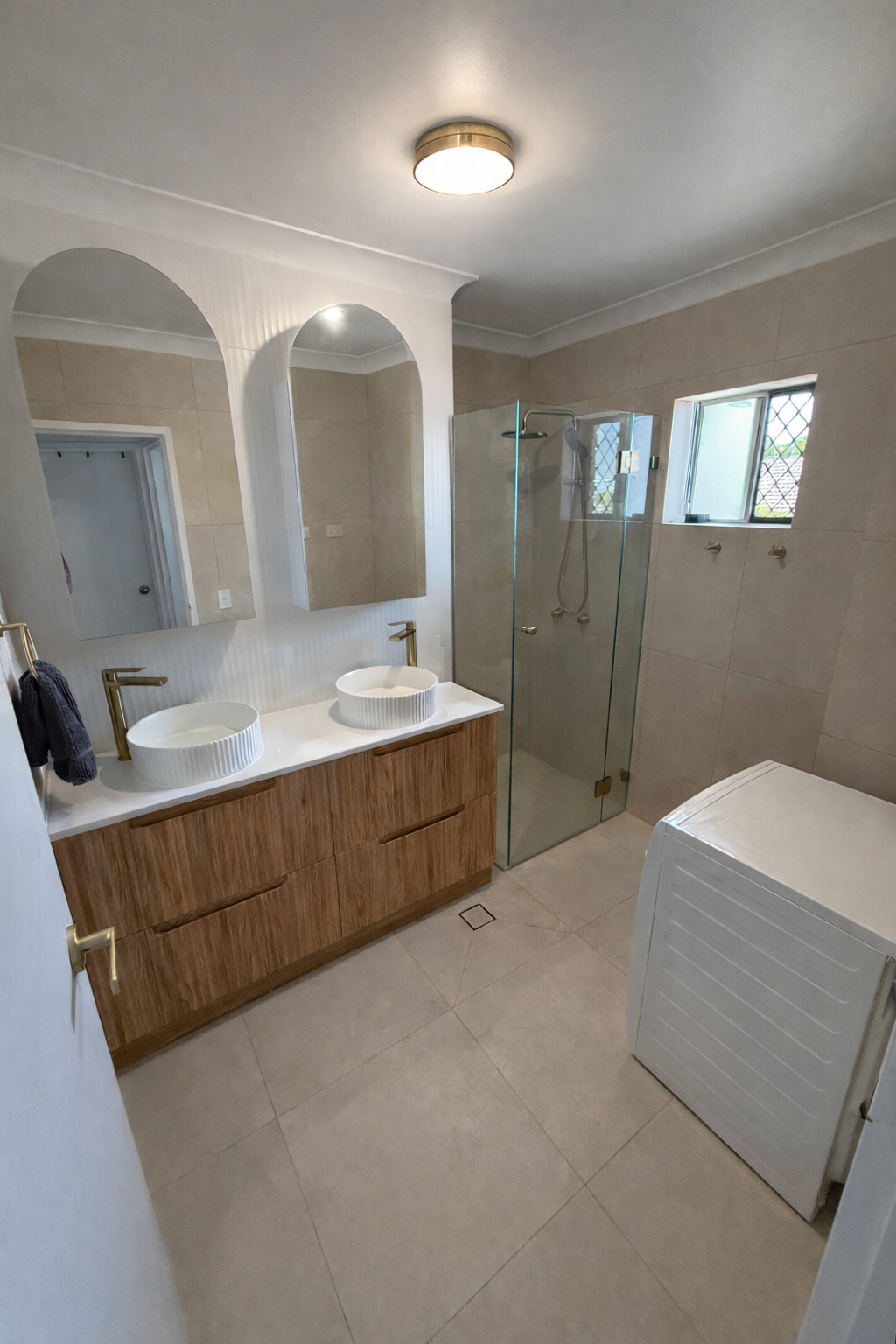 Modern Bathroom with Double Vanity and White Laundry Hamper — JPR Concepts in Burleigh Heads, QLD