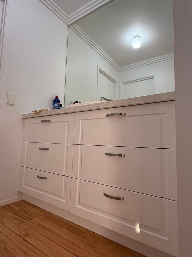 Built In White Cabinet Drawers with Mirror Above in A Bright Hallway — JPR Concepts in Burleigh Heads, QLD
