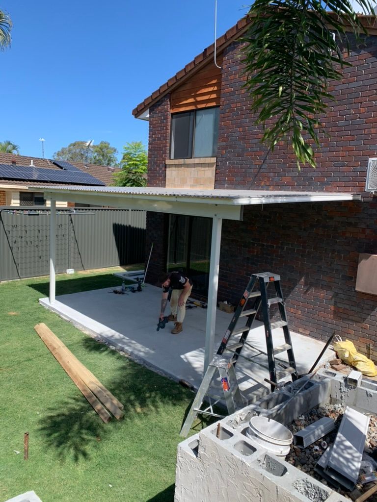 Backyard Patio Under Construction Beside a Brick House — JPR Concepts in Burleigh Heads, QLD
