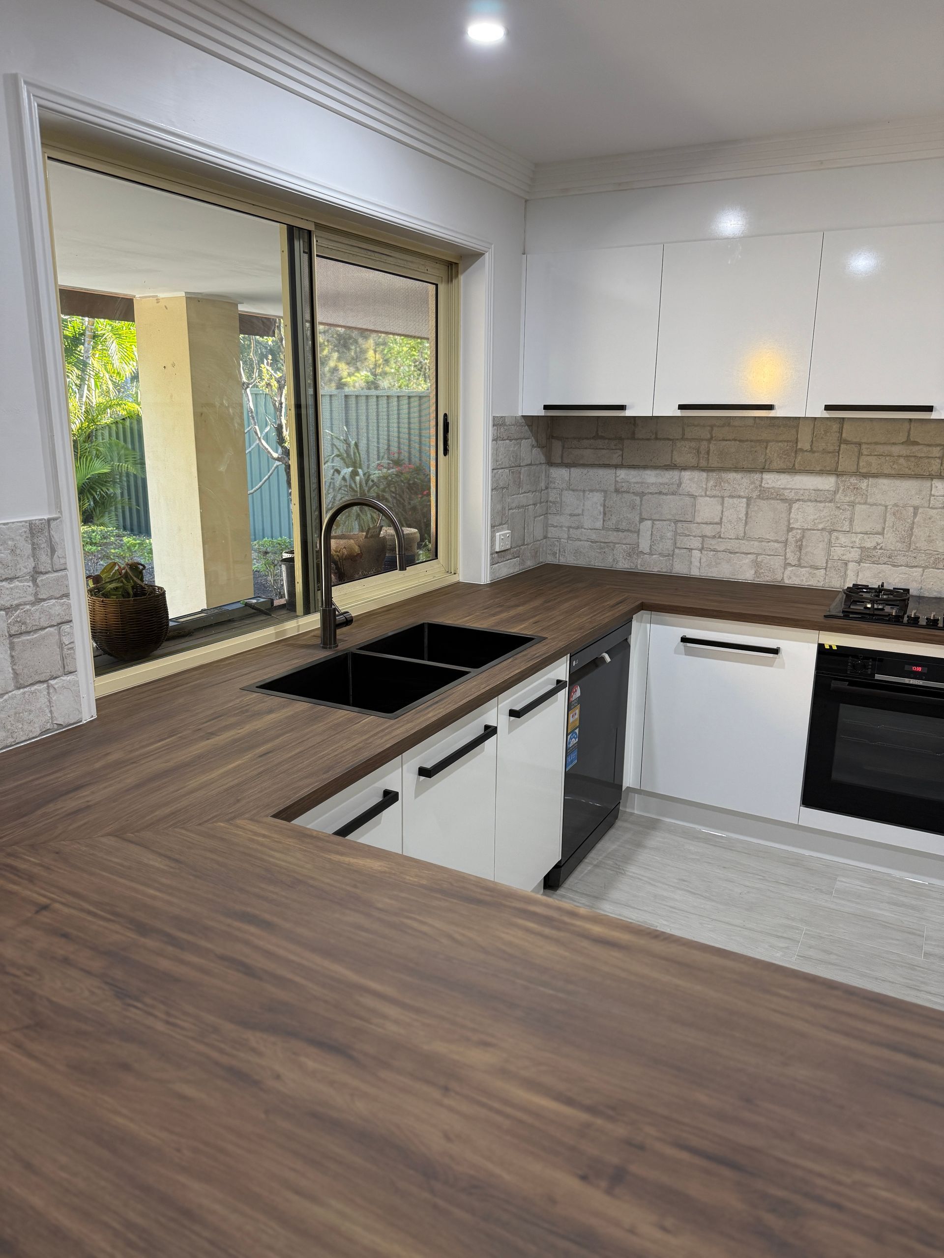 Modern Kitchen with Wood Countertops — JPR Concepts in Burleigh Heads, QLD