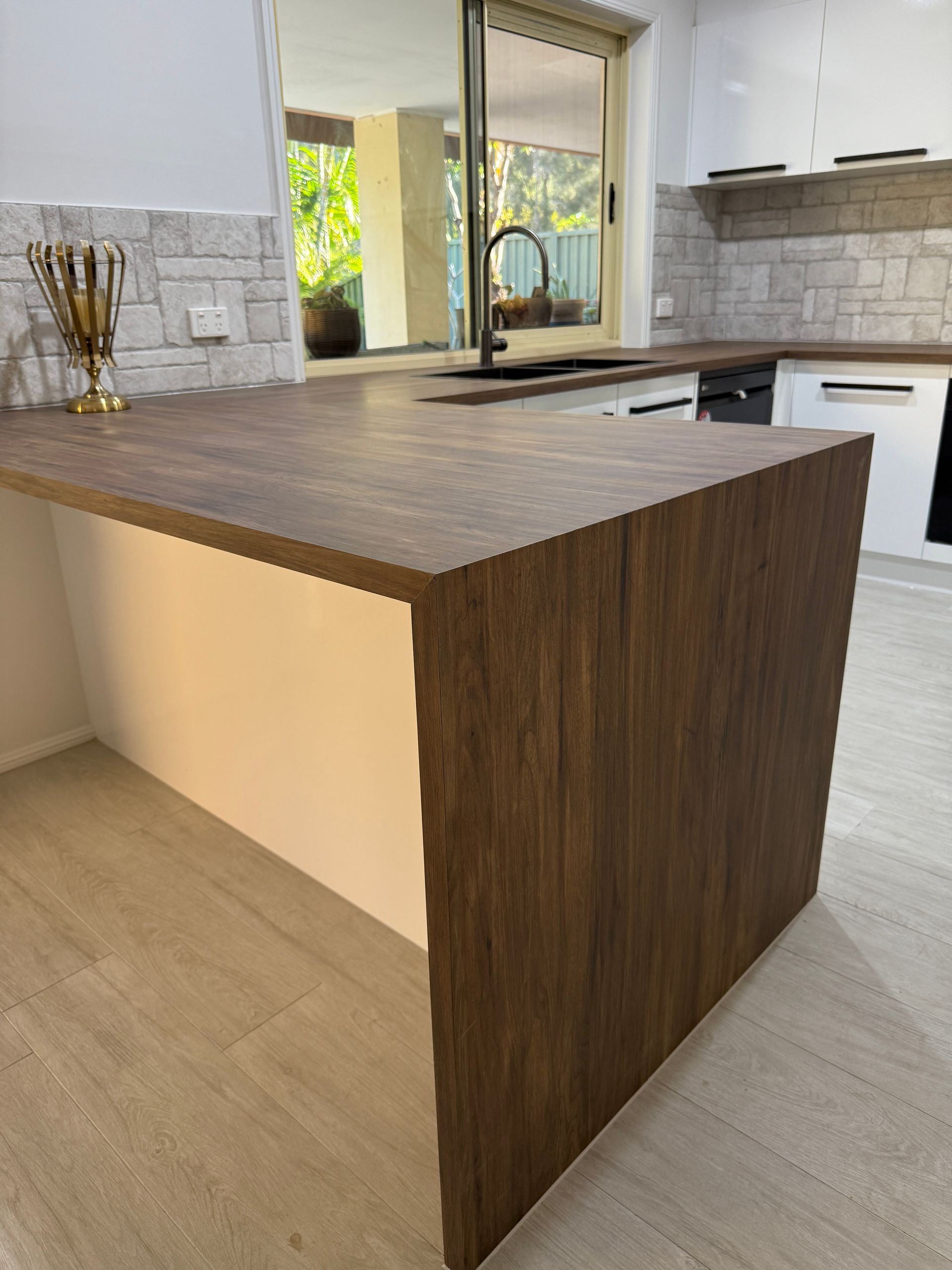 Modern Kitchen Island with Wood Look Sides and Countertop in A Bright Interior — JPR Concepts in Burleigh Heads, QLD