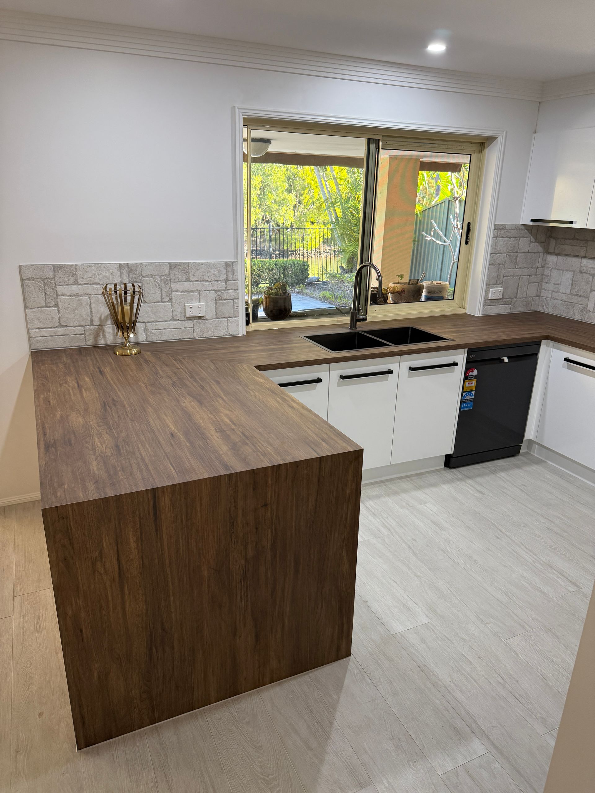 Modern Kitchen with Wood Island and Window View to Greenery — JPR Concepts in Burleigh Heads, QLD