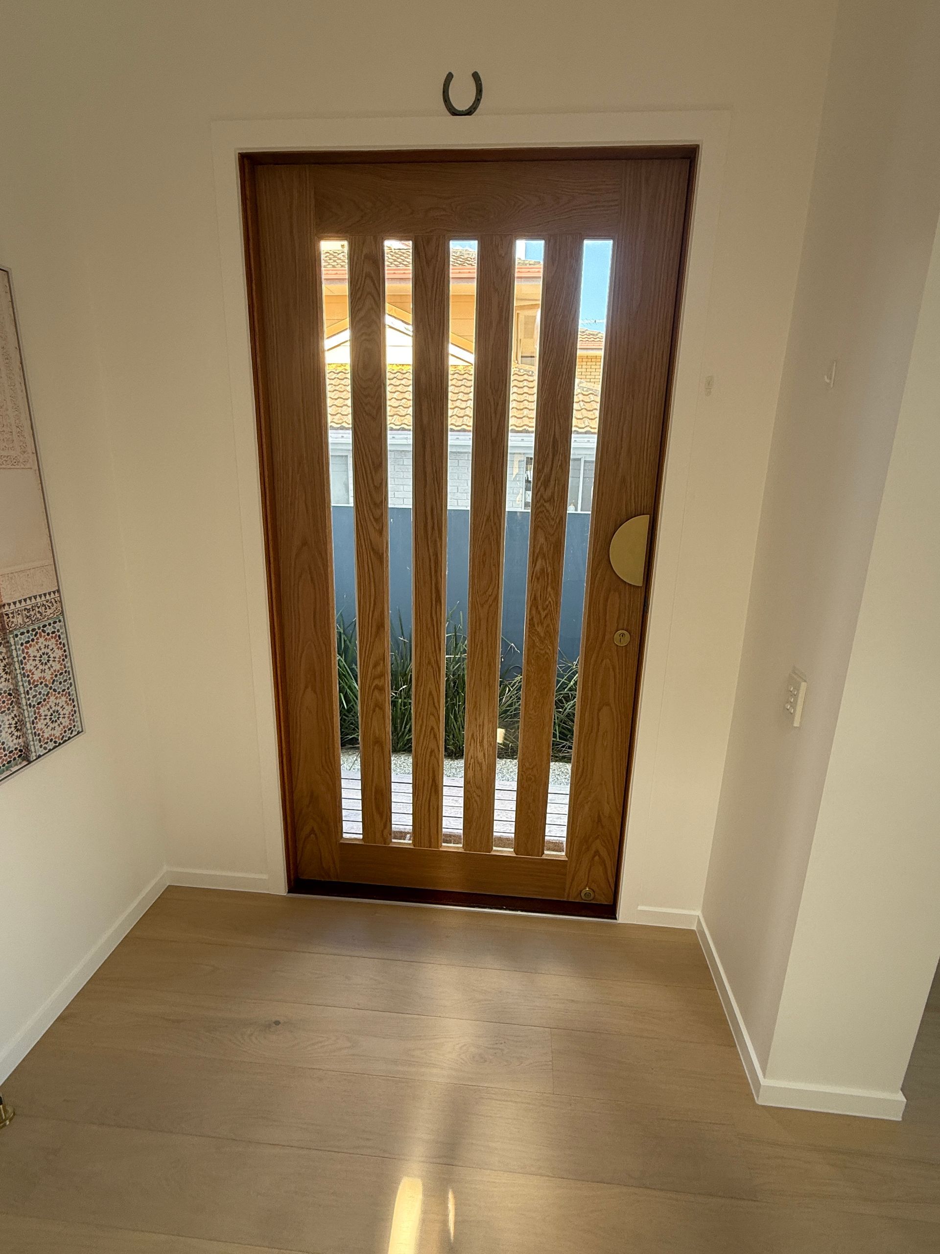 Wooden Front Door with Vertical Glass Panels in A Small Entryway — JPR Concepts in Burleigh Heads, QLD