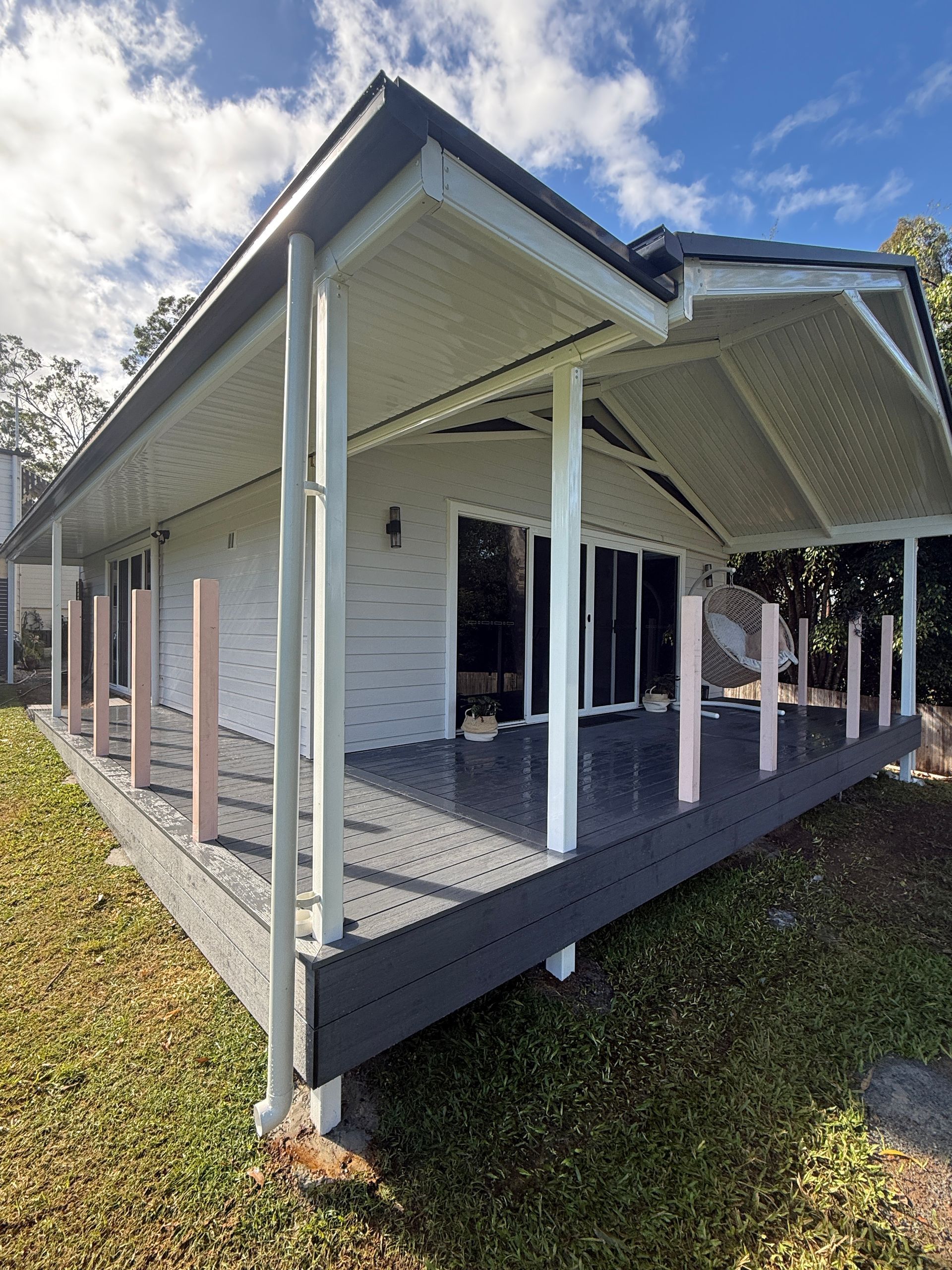 Covered Porch with White Posts and Dark Trim on A Small House — JPR Concepts in Burleigh Heads, QLD