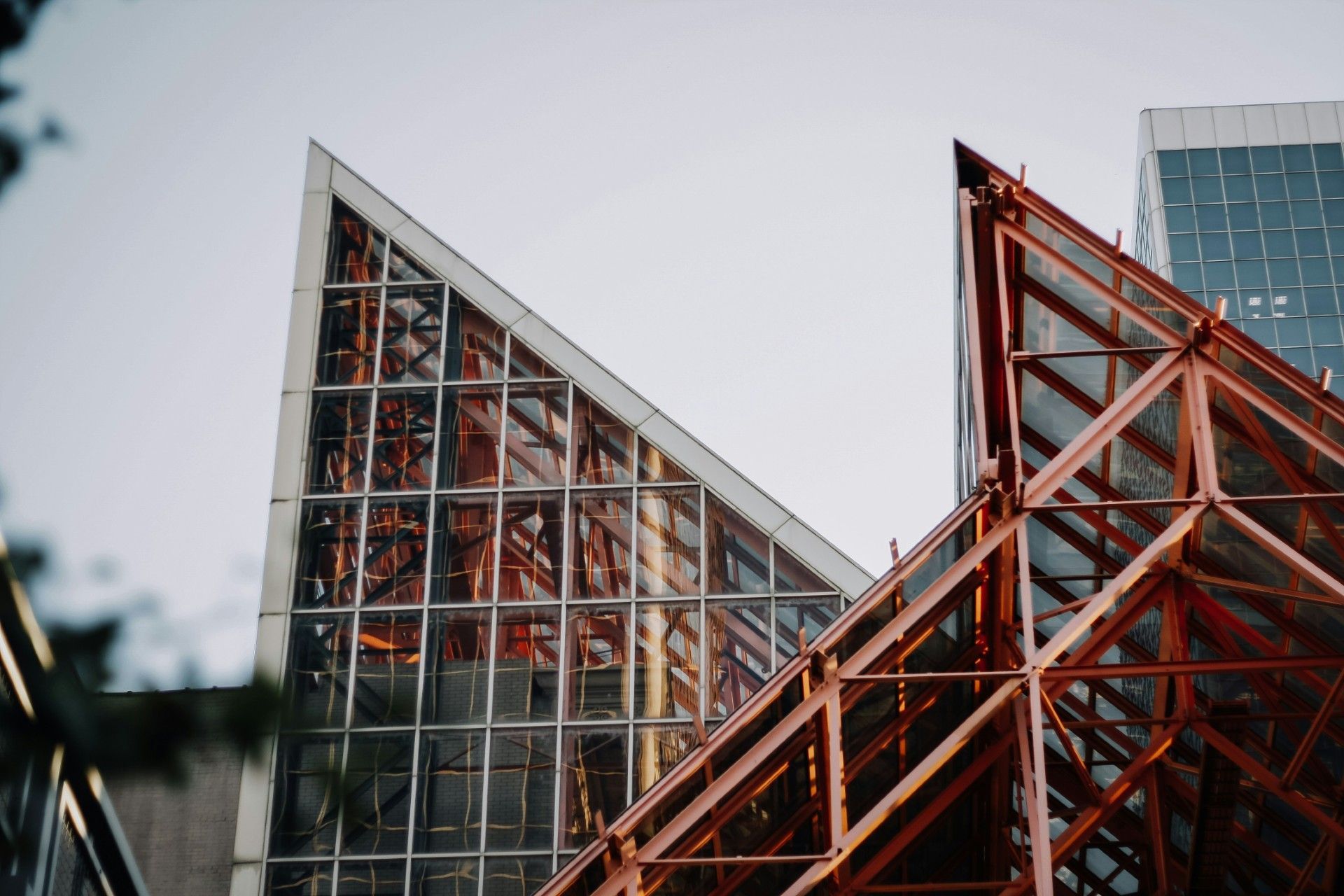 A building under construction with a lot of windows and a metal structure.